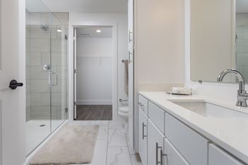 Modern bathroom with glass shower and double vanity
